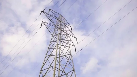 Low Angle of Electric Pylon Against Clouds Stock Footage 79995675