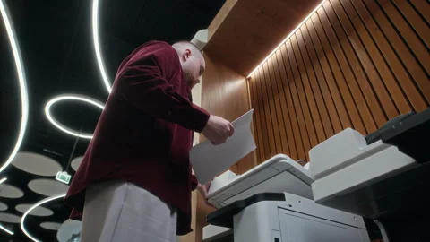 Low Angle of Employee Making Copies of Documents at Office Video stock 312858899