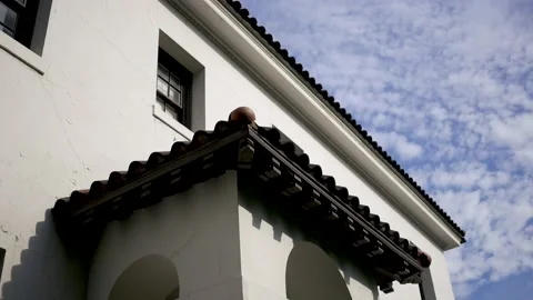 Low Angle Establishing Shot of Clouds Passing Old Tuscan Historical Building Stock Footage 210873078