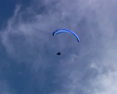 Low angle extreme long shot of a paraglider Stock Footage 36645081