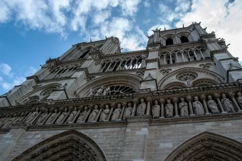 A low angle of the facade of the Cathedral Notre Dame de Paris Paris France w Stock Photos