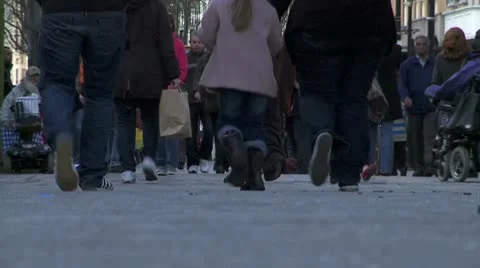 Low angle  of feet rushing past in busy crowd timelapse Stock Footage 10792636