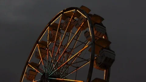 Low Angle of Ferris Wheel moving Quickly Stock Footage 92759615