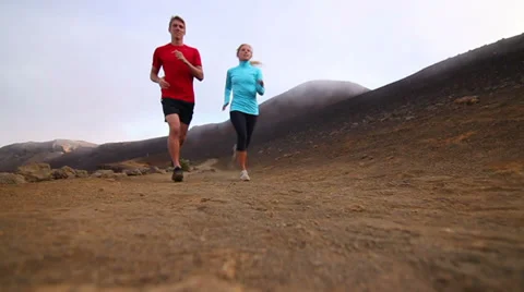 Low Angle Fit Young Couple Trail Running in Nature (Slow Motion) Stock Footage