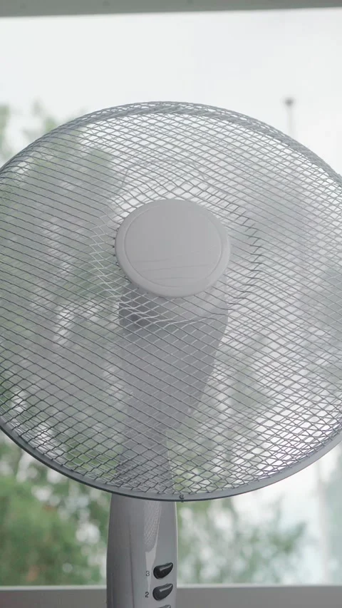 Low angle floor fan by window loop Stock Footage 344691959