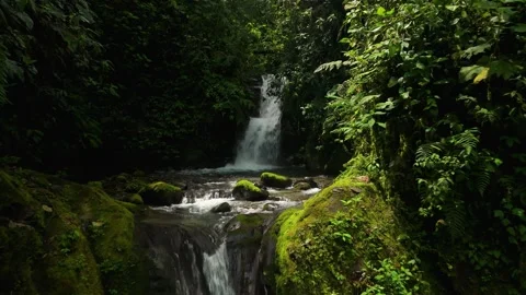 Low Angle Flyby Past Cascading Waterfalls and Mossy Rocks in Mindo Forest 스톡 동영상 331010728