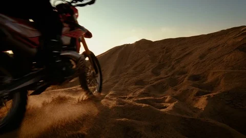 Low Angle Following Shot of the Professional Motocross Motorcycle Rider Driving  Stock Footage 80367341