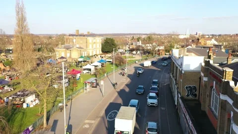 LOW ANGLE FORWARD DRONE REVEAL CITY PARK AT SUNSET Video stock 150127128