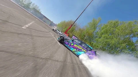 Low-Angle FPV Drift Battle Highlighting Chaser Car With Heavy Smoke Stock Footage 328471340