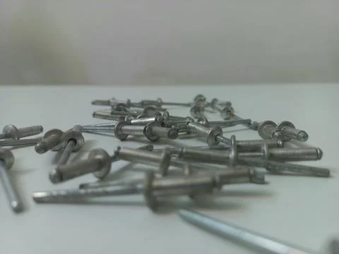 Low Angle Ground View of Stacked Blind Rivets Stock Photos