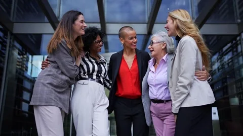 Low angle. Group diverse smiling business women gathered talking happy making Stock Footage 316988125