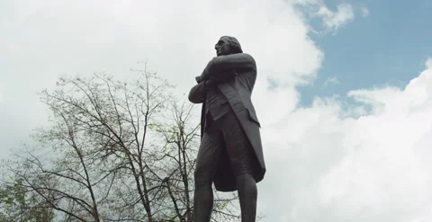 Low angle handheld Samuel Adams Statue at Faneuil Hall in Boston Stock Footage 219107618