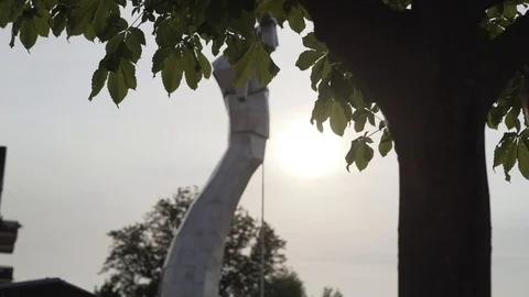 Low angle handheld shot of metallic statue against sky Video stock 120062748