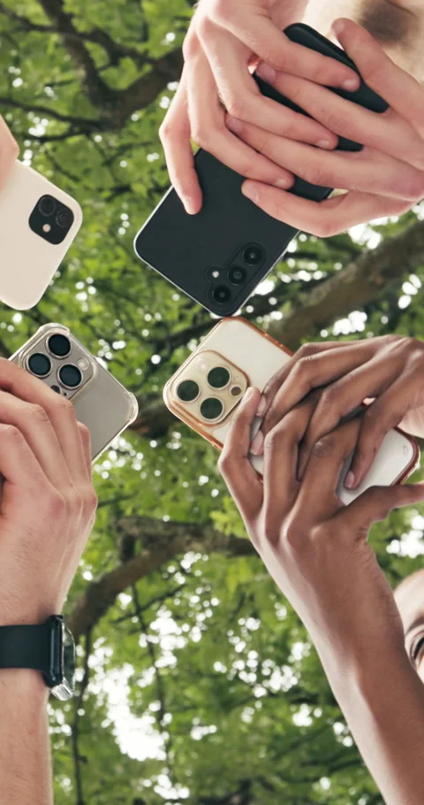 Low angle, hands and students with phones for connection, data sync and laughing Stock Footage 347254100