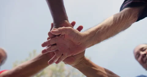 Low angle, hands stack and team building with people outdoor for support and Stock Footage 263813468