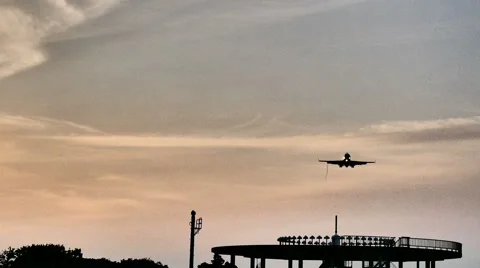 Low angle, high contrast shot of a landing airplane showing airflow. Stock Footage 61720602