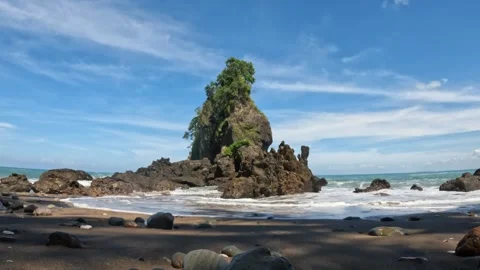 Low angle of high coral rock with blue sky background Stock Footage 319805866