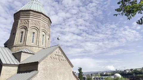 Low Angle Of Historic Saint George Church And Cable Car Over Old Tbilisi City Stockbeeldmateriaal 335125989