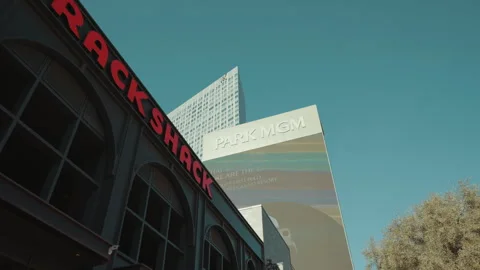 Low angle hotel tower against blue sky in Las Vegas Video stock 347834047