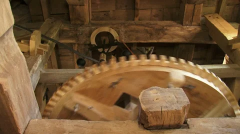 Low angle - interior industrial windmill - wooden cogwheels and the governor Stock Footage 34591543