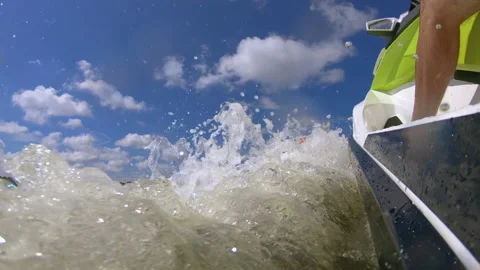 Low angle on a Jet Ski crusing along in slow motion 스톡 동영상 147980288