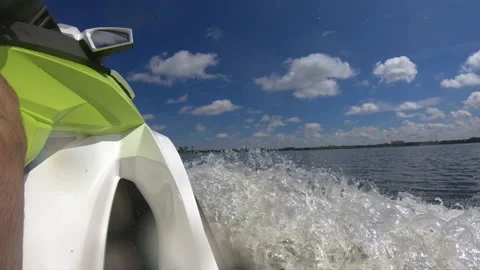 Low angle on a Jet Ski crusing along in slow motion Stock Footage 147980411