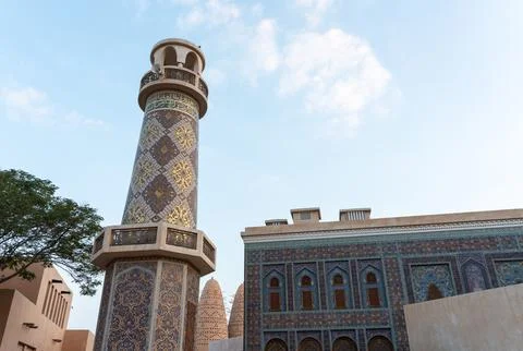Low Angle of Katara Mosque Minaret and Tiled Facade with Copy Space  Stock Photos