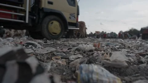 Low angle landfill and garbage collector on background and foreground trash Stock Footage 201327472
