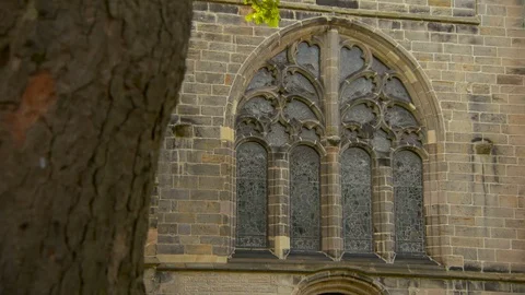 Low angle lockdown shot of closed concrete arch window on building in city - Stock Footage 129218022