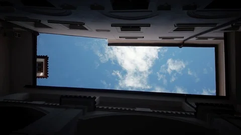 Low angle looking up at buildings and sky with clouds passing in Prague Stock Footage 85366087