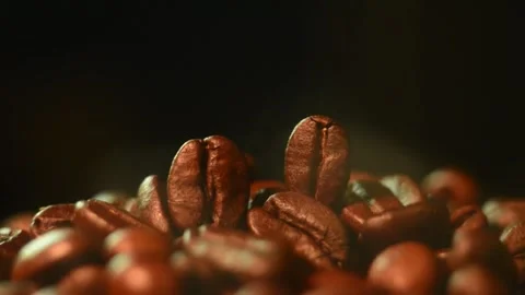 Low-Angle Macro Video of Steaming Coffee Beans Stock Footage 345041875