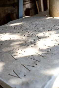 Low angle macro view of carved Latin letters 库存照片