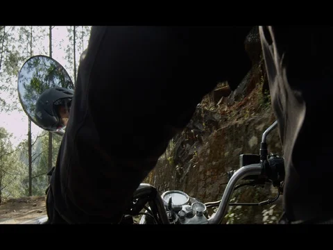 Low Angle of man riding motorcycle in Northern India Stock Footage 73006711