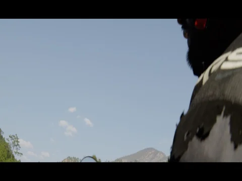 Low Angle of man riding motorcycle in Northern India Stock Footage 73007308