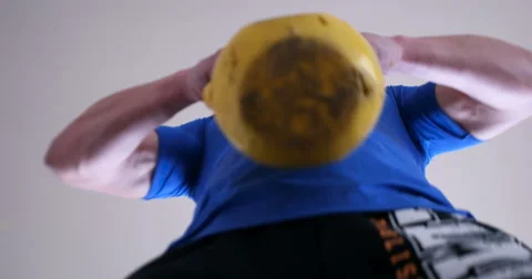 Low angle of man squating with kettlebell weights Stock Footage 67215274