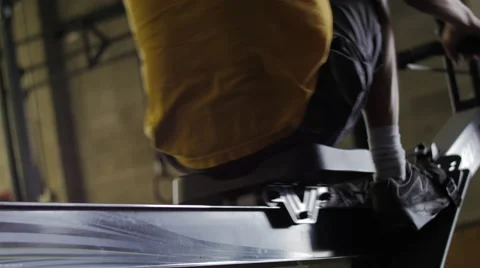 Low Angle of Man Warming Up on Rower Stock Footage 42235676