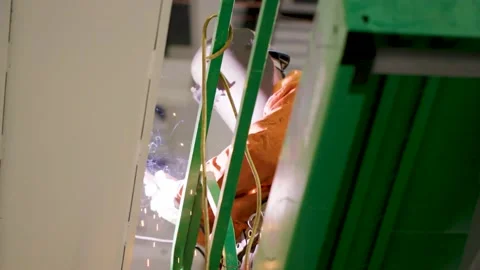 Low angle of Man welding in warehouse Stock Footage 229654145