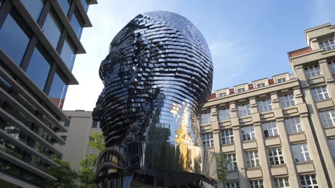 Low angle medium of the Franz Kafka head statue in Prague rotating Video stock 284816242
