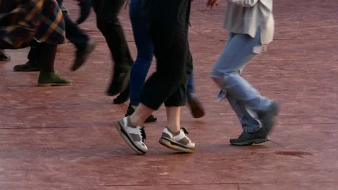 Low angle medium shot of feet of a group of dancers dancing together Stock Footage 103288231