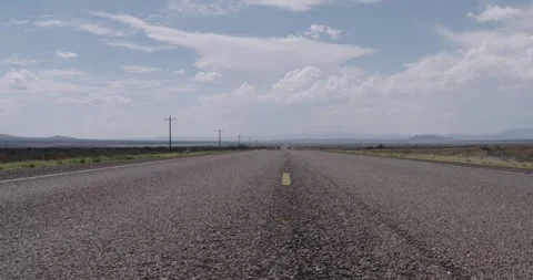 Low Angle in the Middle of the Road - West Texas USA Stock Footage 256049756
