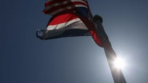 Low Angle of Mississippi State Flag Slow Motion Lens Flare Video stock 108573042