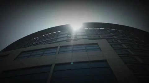 Low Angle  Modern Curved Office Building Under Bright Sunlight Stock Footage 331492676
