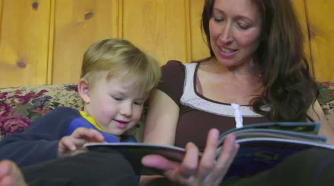 Low angle of mom reading to kid Stock Footage 66257900