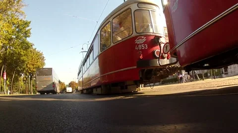Low angle in motion shot of the car driving on Vienna ring with tram Stock Footage 21452935