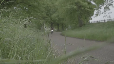 Low Angle Motorbike Whizzing Past 库存影片 242587342