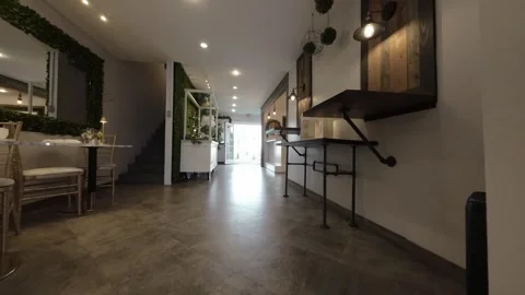 Low angle move through barn doors into a venue hallway Stock Footage 345561591