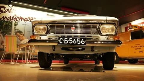 Low-Angle Moving Front Shot of Beige Moskvitch 408 at Retro Museum Varna Stock Footage 320896398
