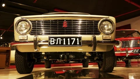 Low-Angle Moving Front Shot of Beige Lada 2101 at Retro Museum Varna Stock Footage 320896399