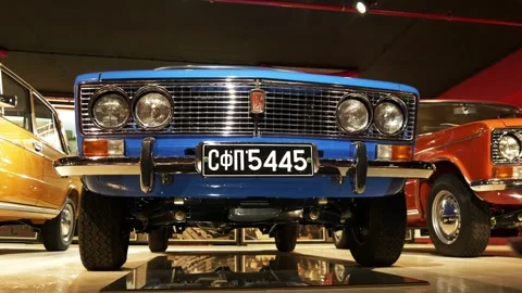 Low-Angle Moving Front Shot of Blue Lada 1600 (VAZ 2106) at Retro Museum Varna Stock Footage 320896424