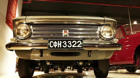 Low-Angle Moving Front Shot of Beige Moskvitch at Retro Museum Varna Stock Footage 320896427